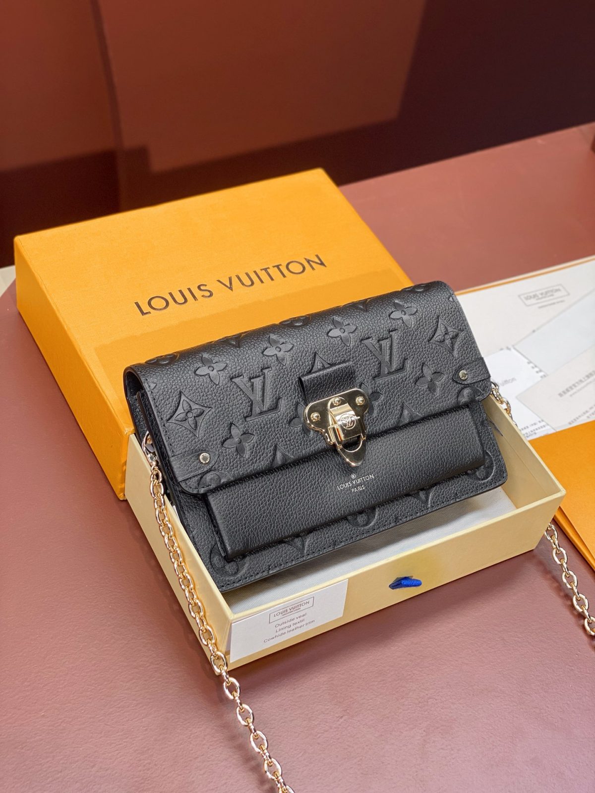 Louis Vuitton Chain Wallet | Monogram Empreinte Leather Collection - Image 1