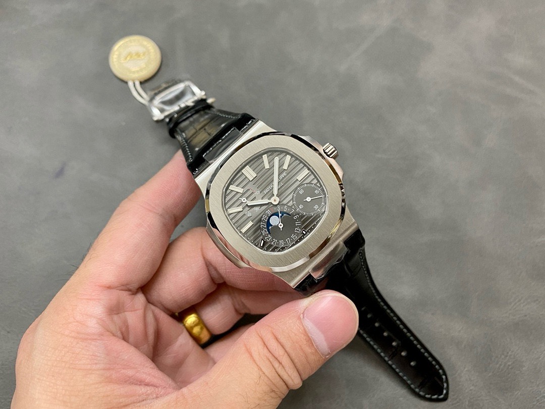 Dong-Ho-Patek-Philippe-Rep-11-Nautilus-5712-Mat-Xam-Khoi-Nha-May-PPF-40mm-5.jpg Patek Philippe Best Replica Watch Nautilus 5712 Gray Dial Leather Strap PPF 40mm - Image 1